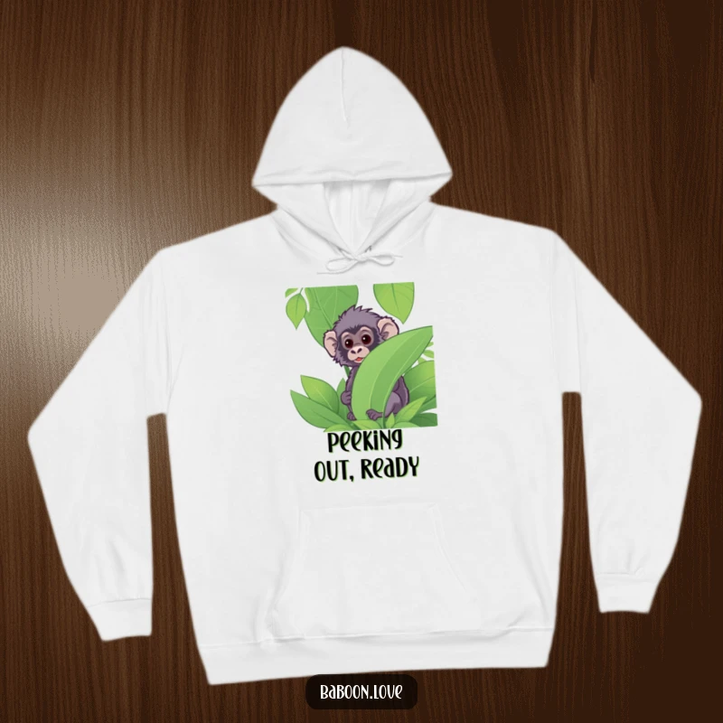 Funny Hoodie: A curious baboon peeks from behind dense jungle foliage, offering warmth and a touch of playful mystery in its design.