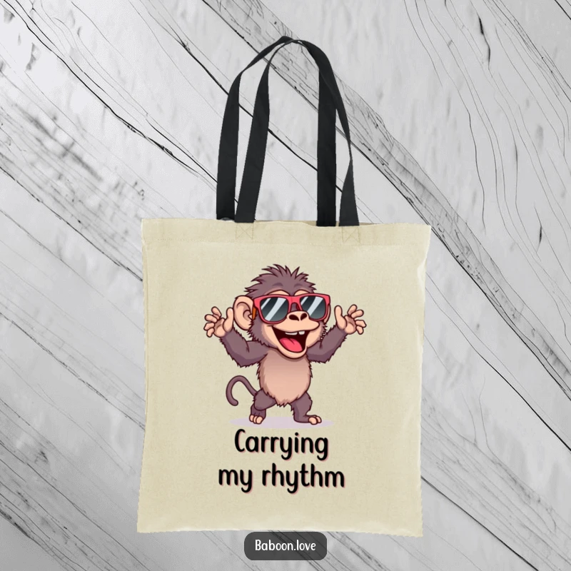 Funny tote bag showcasing a baboon in large sunglasses, energetically dancing with a carefree and joyful attitude.